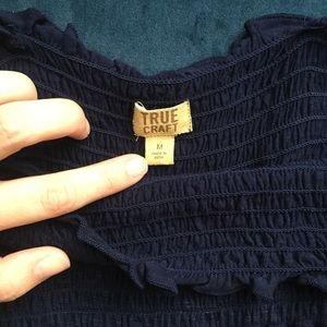 Off the shoulder navy blue top.